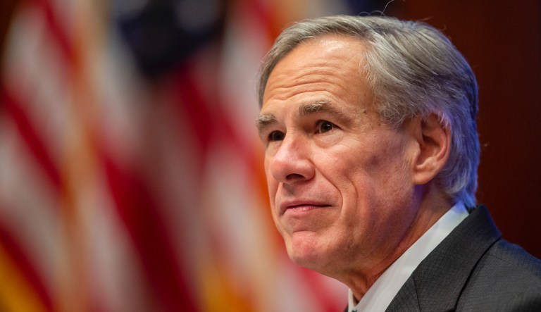 Texas Gov. Greg Abbott adjusts his mask after giving an update on the categories of medical surge facilities and how it effects Level 5 of maintaining staffed beds during a press conference at Texas Department of Public Safety on Tuesday, June 16, 2020.