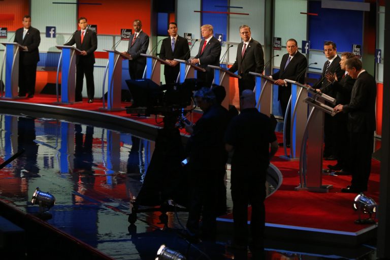 Republican presidential candidates from left, Chris Christie, Marco Rubio, Ben Carson, Scott Walker, Donald Trump, Jeb Bush, Mike Huckabee, Ted Cruz, Rand Paul, and John Kasich take the stage for the first Republican presidential debate at the Quicken Loans Arena Thursday, Aug. 6, 2015, in Cleveland. (AP Photo/Andrew Harnik)