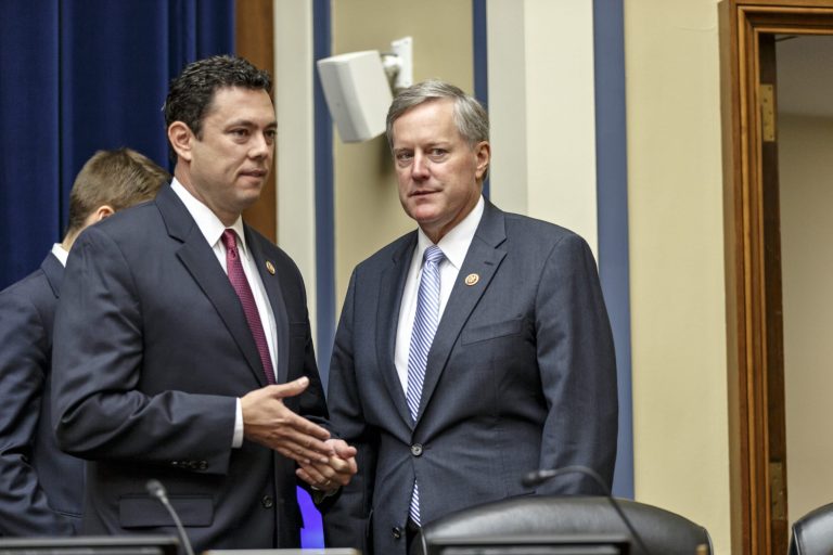 Rep. Jason Chaffetz, R-Utah, left, and Rep. Mark Meadows, R-N.C., confer as the House Oversight Committee meets to hear from U.S. Secret Service Director Julia Pierson about a security breach at the White House on Capitol Hill in Washington, Tuesday, Sept. 30, 2014. (AP Photo/J. Scott Applewhite)
