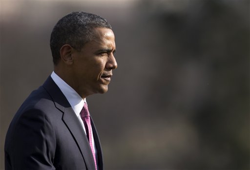 President Barack Obama walks across the South Lawn to the Oval Office of the White House in Washington, Tuesday, March 5, 2013, (AP Photo/Carolyn Kaster)