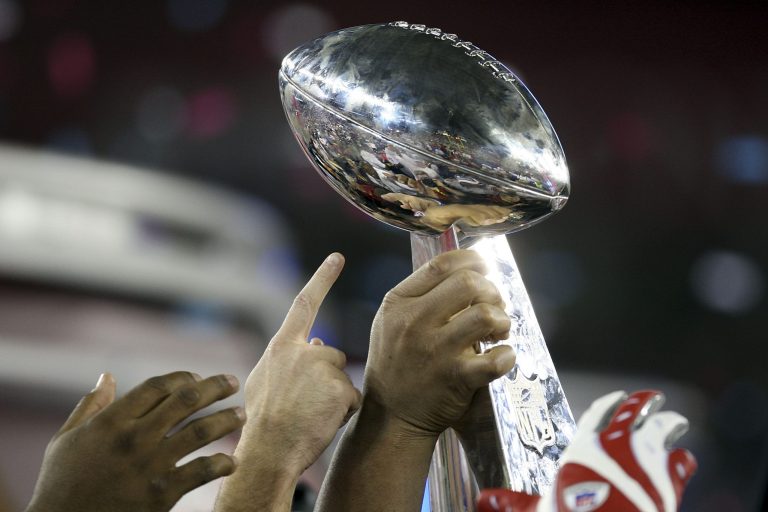 The New York Giants hold the Vince Lombardi Trophy after defeating the New England Patriots at Super Bowl XLII on February 3, 2008 at the University of Phoenix Stadium in Glendale, Arizona.ÃÂ Sports Illustrated has confirmed that Arizona could lose its chance to host the next Super Bowl if the state passes a controversial religious freedom bill.ÃÂ (Photo by Elsa/Getty Images)