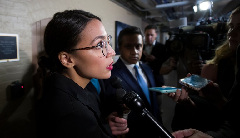 New York congressional candidate Alexandria Ocasio-Cortez listens to a speaker at a fundraiser Thursday, Aug. 2, 2018, in Los Angeles. The 28-year-old startled the party when she defeated 10-term U.S. Rep. Joe Crowley in a New York City Democratic primary. Ocasio-Cortez is a rising liberal star who is challenging the Democratic Party establishment.