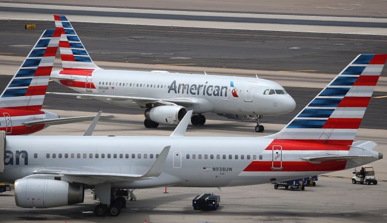 American Airlines' planes are parked at a gate at LaGuardia Airport in New York, Tuesday, Nov. 29, 2011.