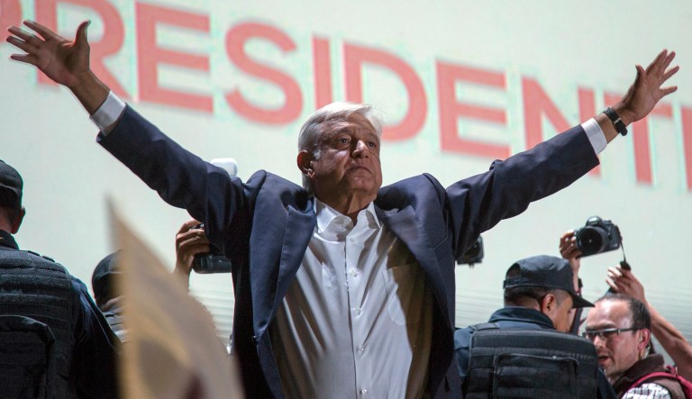 Presidential candidate Andres Manuel Lopez Obrador acknowledges his supporters as he arrives to Mexico City's main square, the Zocalo, Sunday, July 1, 2018. Lopez Obrador has claimed victory in Mexico's presidential election, calling for reconciliation.