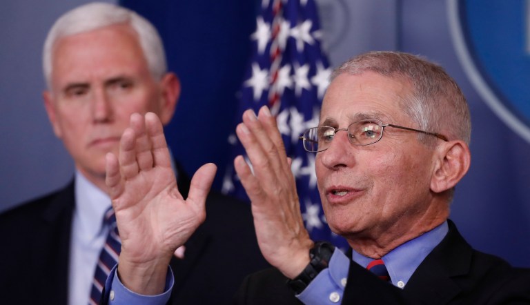 Director of the National Institute of Allergy and Infectious Diseases Dr. Anthony Fauci speaks during a coronavirus task force briefing at the White House, Saturday, March 21, 2020, in Washington. Adm. Brett Giroir, assistant secretary for health, center, and Vice President Mike Pence listen.