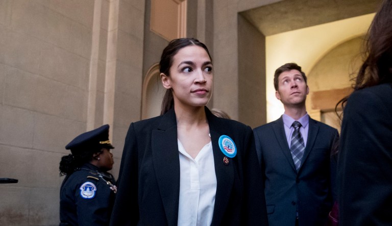 Rep. Alexandria Ocasio-Cortez, D-N.Y., center, and Rep. Veronica Escobar, D-Texas, right, and other freshman Congressmen deliver a letter calling to an end to the government shutdown to the office of Senate Majority Leader Mitch McConnell of Ky., on Capitol Hill in Washington, Wednesday, Jan. 16, 2019.