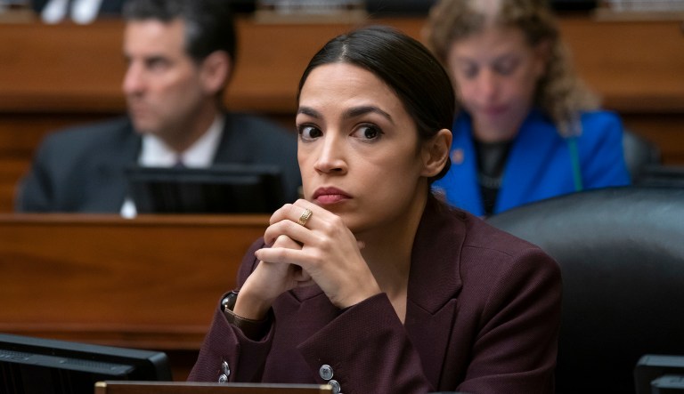 Rep. Alexandria Ocasio-Cortez, D-N.Y., listens to questioning of Michael Cohen, President Donald Trump's former personal lawyer, at the House Oversight and Reform Committee, on Capitol Hill in Washington, Wednesday, Feb. 27, 2019.