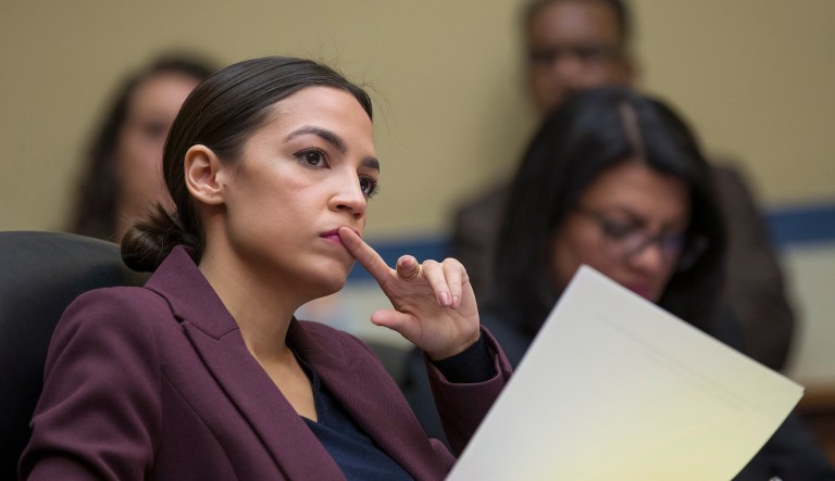 Rep. Alexandria Ocasio-Cortez, D-N.Y., listens to questions as Michael Cohen, President Donald Trump's former personal lawyer, testifies before the House Oversight and Reform Committee, on Capitol Hill, Wednesday, Feb. 27, 2019, in Washington.