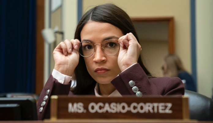 Rep. Alexandria Ocasio-Cortez, D-N.Y. works the crowd during an election rally with Democratic presidential candidate Sen. Bernie Sanders, I-Vt., on the campus of Iowa Western Community College in Council Bluffs, Iowa, Friday, Nov. 8, 2019. 