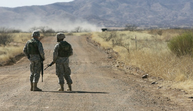 In this March 1, 2007 file photo, Tennessee National Guardsmen stand watch near the Arizona-Mexico border in Sasabe, Ariz.   About 400 Tennessee soldiers are currently deployed in Arizona as a part of Operation Jumpstart, involving 6,000 Guardsmen working in support of Border Patrol efforts in Texas, Arizona, New Mexico and California.