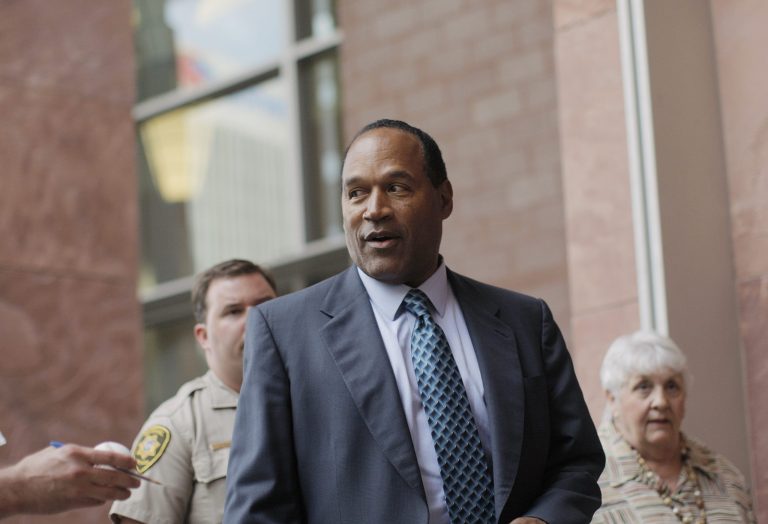 O.J Simpson, center, leaves the Clark County Regional Justice Center after his trial in Las Vegas, Tuesday, Sept. 16, 2008. Simpson faces 12 charges, including felony kidnapping, armed robbery and conspiracy.