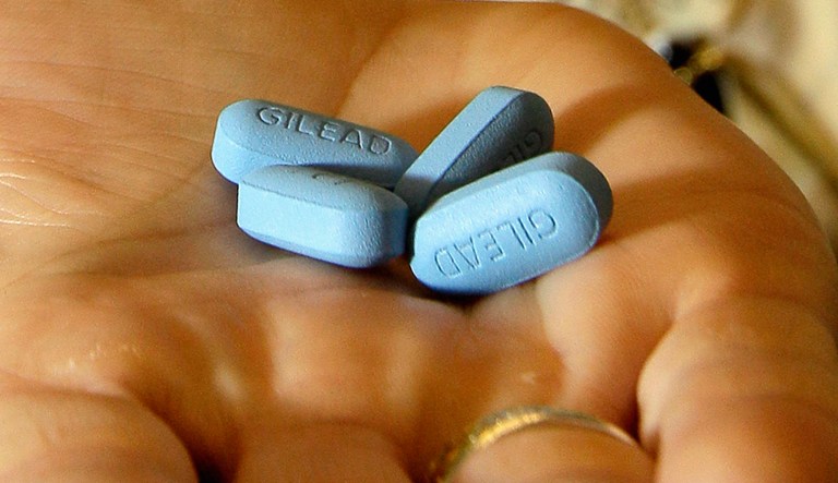 A doctor holds Truvada pills at her office in San Francisco. The pill has been shown to reduce the risk of getting HIV from sex by more than 90 percent if taken daily.