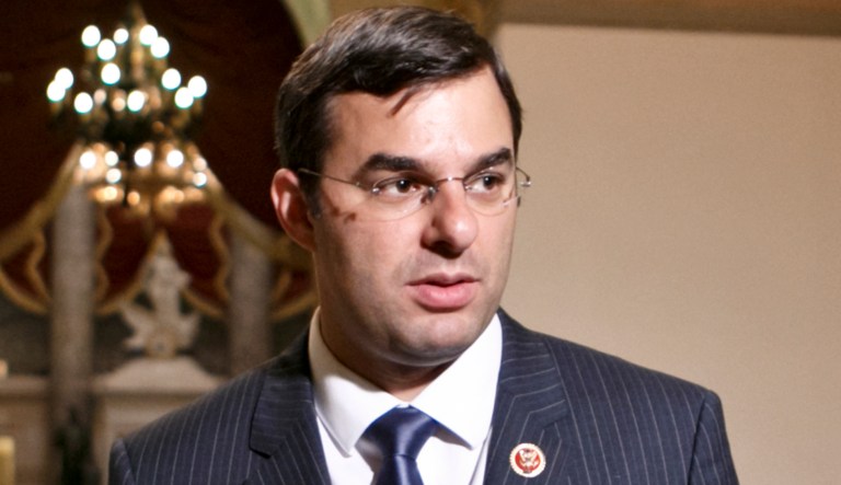 Rep. Justin Amash, R-Mich., walks through a hallway on Capitol Hill in D.C.
