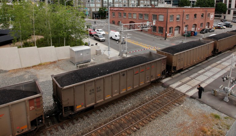A train hauling coal heads north out of Seattle.