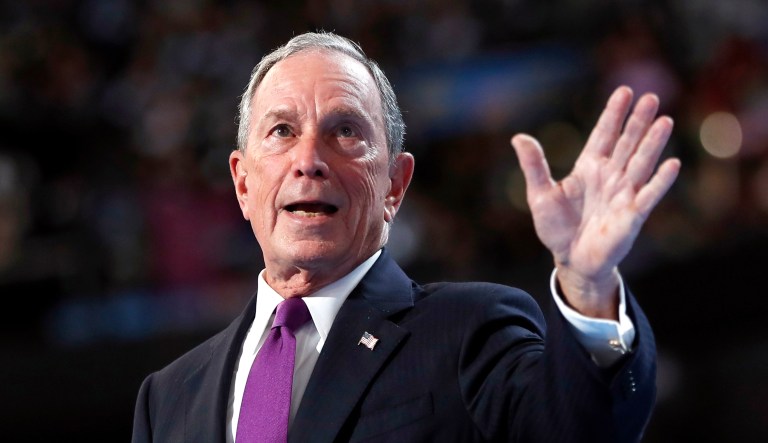 Former New York City Mayor Michael Bloomberg waves after speaking.