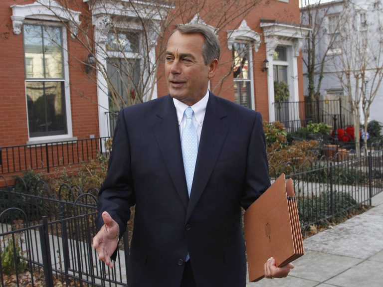 In this Jan. 5, 2011 file photo, then-Rep. John Boehner, R-Ohio, who was elected House Speaker later that day during the 112th Congress, walks out of his home on Capitol Hill in Washington. 