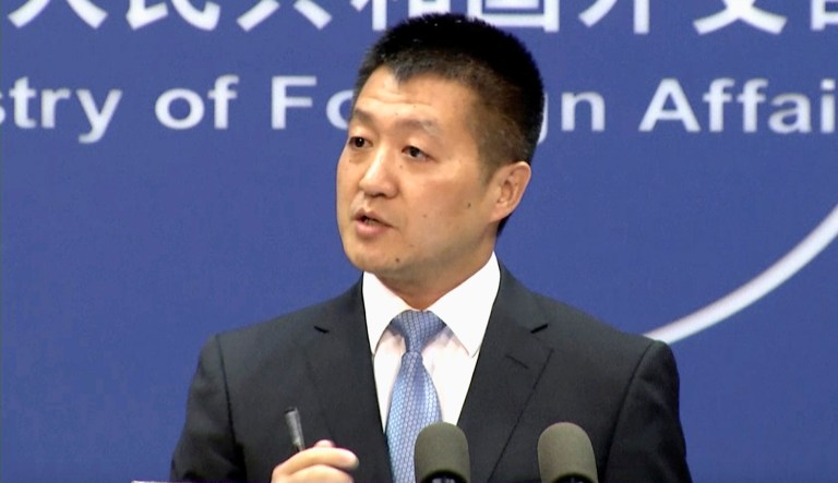 Lu Kang, the most senior spokesman of China's Foreign Affairs Ministry, speaks to reporters during a news briefing in Beijing.