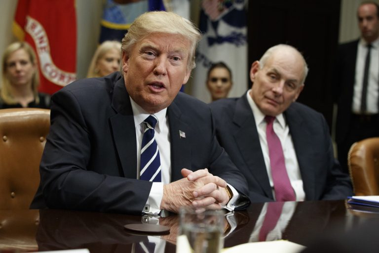 Homeland Security Secretary John Kelly listens at right as President Donald Trump speaks during a meeting on cyber security in the Roosevelt Room of the White House in Washington, Tuesday, Jan. 31, 2017. 