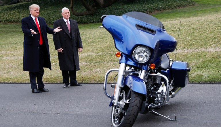 President Trump and Vice President Mike Pence stop to admire a Harley-Davidson motorcycle parked on the South Lawn of the White House on Feb. 2, 2017.