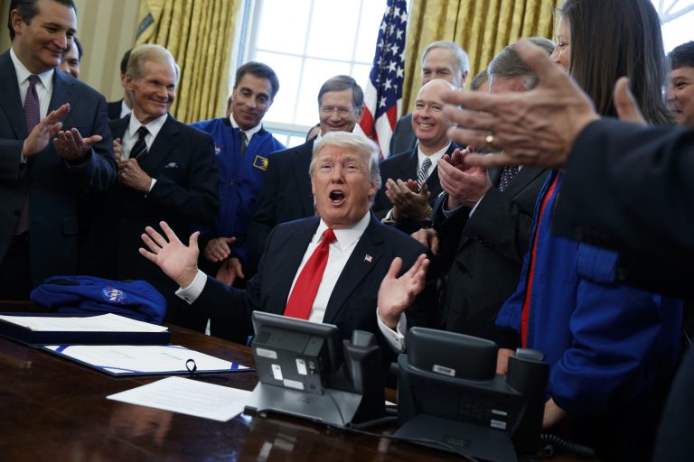 President Donald Trump speaks in the Oval Office of the White House in Washington, Tuesday, March 21, 2017, after signing a bill to increase NASA's budget to $19.5 billion and directs the agency to focus human exploration of deep space and Mars.