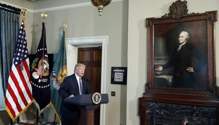 President Donald Trump speaks next to a portrait of the first Treasury Secretary Alexander Hamilton, Friday, April 21, 2017, at the Treasury Department in Washington.