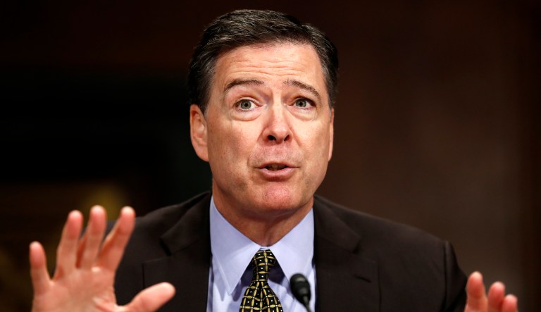 Former FBI Director James Comey testifies on Capitol Hill in Washington.