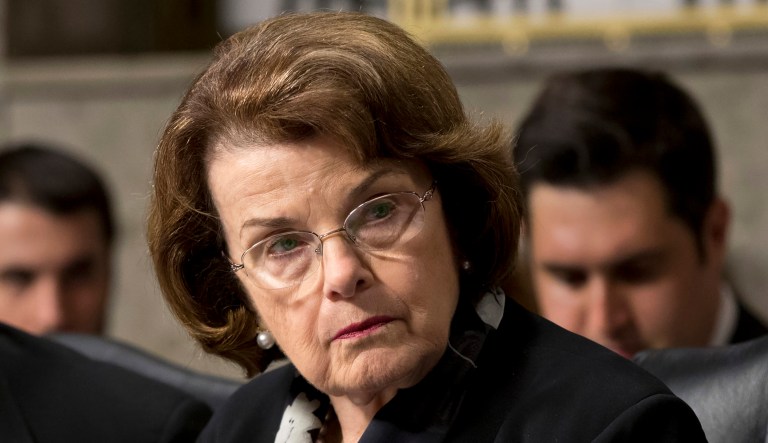 In this June 12, 2013, file photo, Sen. Dianne Feinstein, D-Calif., right, chair of the Senate Intelligence Committee, and Sen. Dick Durbin, D-Ill., listen to testimony from Gen. Keith B. Alexander, director of the National Security Agency and head of the U.S. Cyber Command before the Senate Appropriations Committee. U.S. authorities have said they are reducing the amount of time they will delay deporting the few immigrants in the country illegally awaiting congressional decisions to legalize their immigration status after lawmakers file so-called 