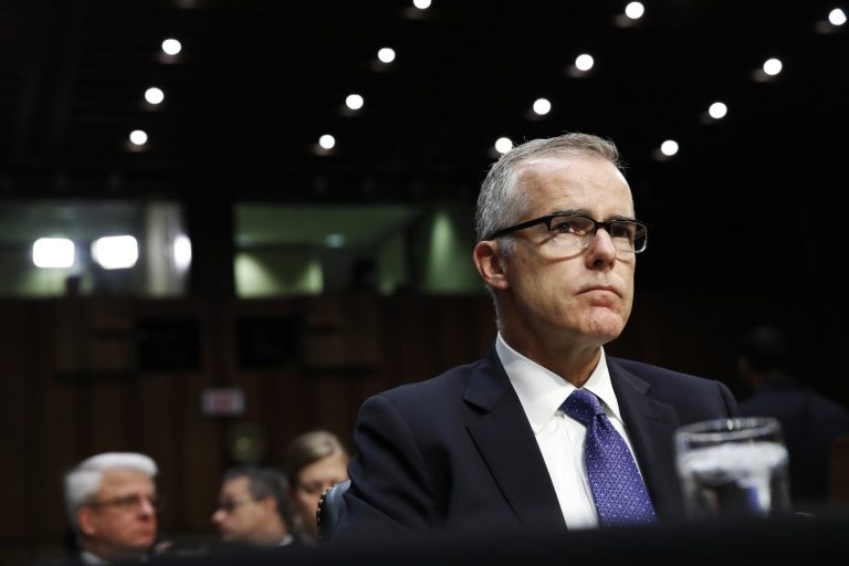 Former FBI Deputy Director Andrew McCabe listens on Capitol Hill during a hearing.