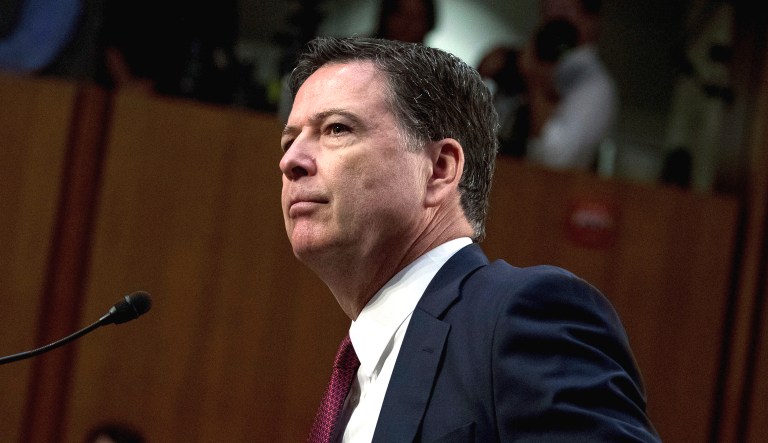 Former FBI Director James Comey pauses during a hearing on Capitol Hill in Washington.