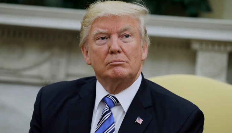 President Trump is seen in the Oval Office of the White House in Washington, Monday, June 19, 2017. A new poll by The Associated Press-NORC Center for Public Affairs Research finds that most Americans say the federal courts were acting properly when they blocked President Donald Trumpâs travel ban from going into effect. 