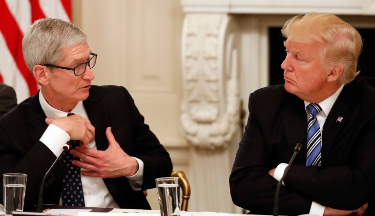 Tim Cook, Chief Executive Officer of Apple, speaks as President Trump listens during an event in Washington.