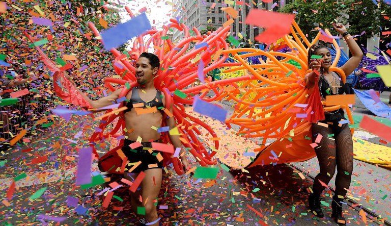 Confetti falls over SF Balloon Magic marchers during the Pride parade in San Francisco, Sunday, June 25, 2017.