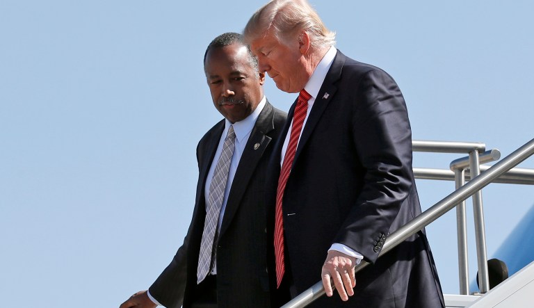 Housing and Urban Development Secretary Ben Carson steps off Air Force One with President Donald Trump as they arrive Wednesday, Aug. 23, 2017, in Reno, Nev.