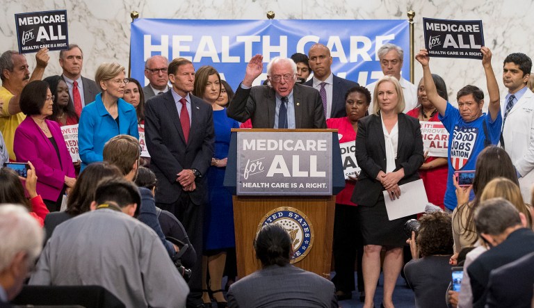 Sen. Bernie Sanders, I-Vt., center, accompanied by other democratic Senators and supporters, speaks at a news conference on Capitol Hill in Washington, Wednesday, Sept. 13, 2017, to unveil their Medicare for All legislation to reform health care.