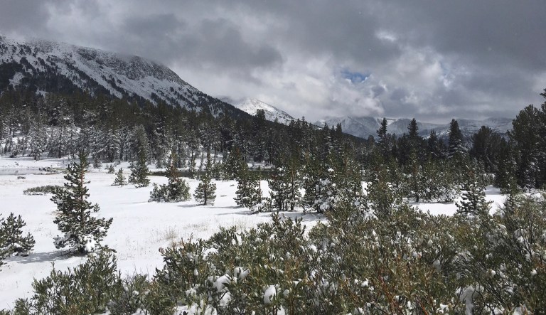 The first snow of the season is seen near Tioga Pass Thursday, Sept. 21, 2017 in Yosemite National Park, Calif. Snow fell in the Sierra Nevada on the last day of summer, giving the towering mountain range shared by California and Nevada a wintry look in September and making travel hazardous. Snow dusted peaks in Yosemite National Park and temporarily closed Tioga Pass road, the soaring eastern entry to the park that typically doesn't become impassable until mid-November.