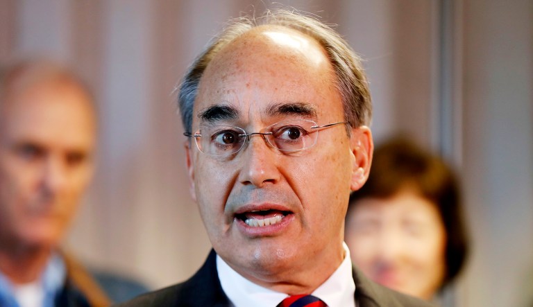 Rep. Bruce Poliquin, R-Maine, speaks at a news conference at Bath Iron Works in Bath, Maine.