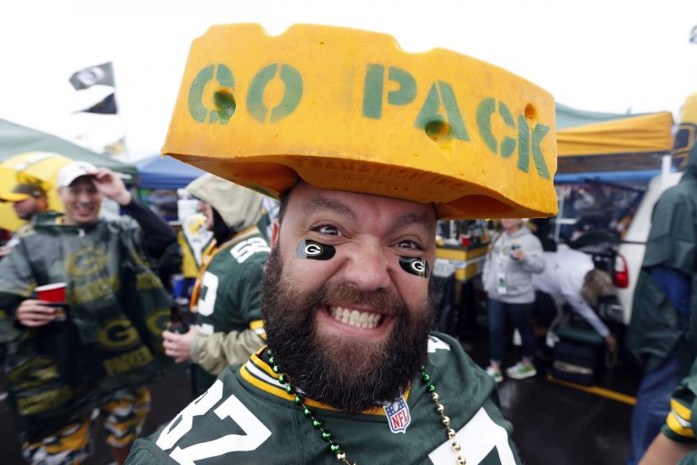 Chris Burdine shows off his color as fans tailgate outside Lambeau Field before an NFL football game, last year. (AP Photo/Mike Roemer)