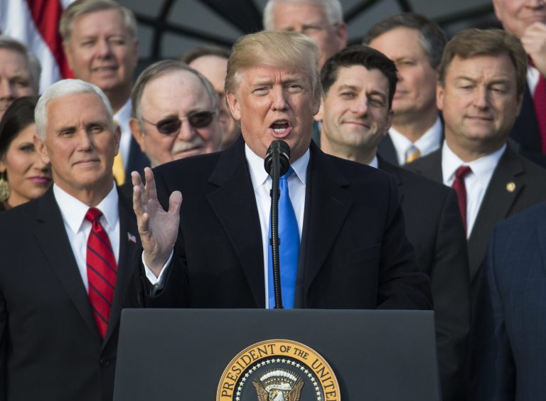 President Donald Trump, joined by Vice President Mike Pence, Speaker of the House Paul Ryan, R-Wis., and other members of congress, speaks during an event on the South Lawn of the White House in Washington, Wednesday, Dec. 20, 2017, to acknowledge the final passage of tax overhaul legislation by congress.