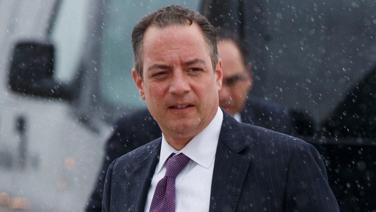 Then-White House Chief of Staff Reince Priebus walks to board Air Force One.