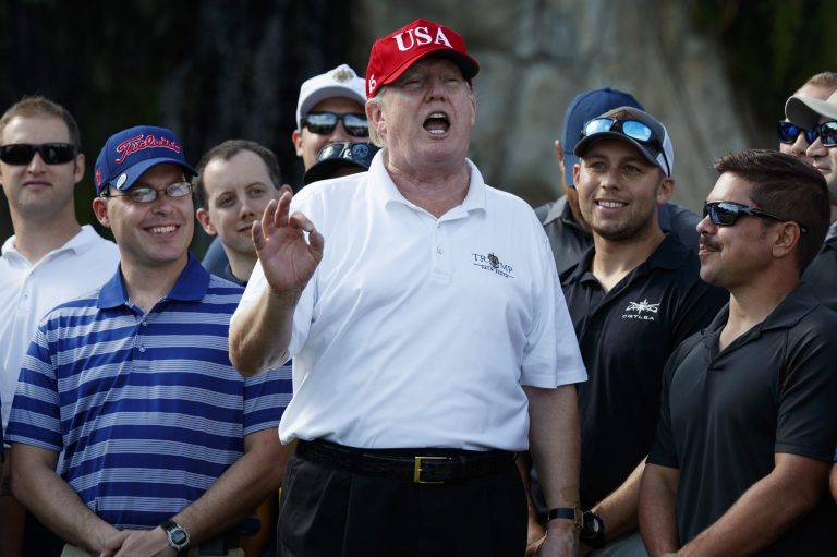 President Donald Trump speaks as he meets with members of the U.S. Coast Guard, who he invited to play golf, at Trump International Golf Club, Friday, Dec. 29, 2017, in West Palm Beach, Fla.
