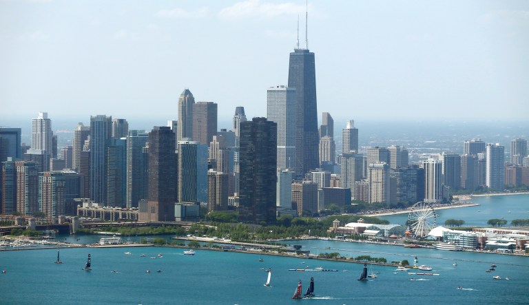 Sailboats practice in front of the downtown Chicago skyline.