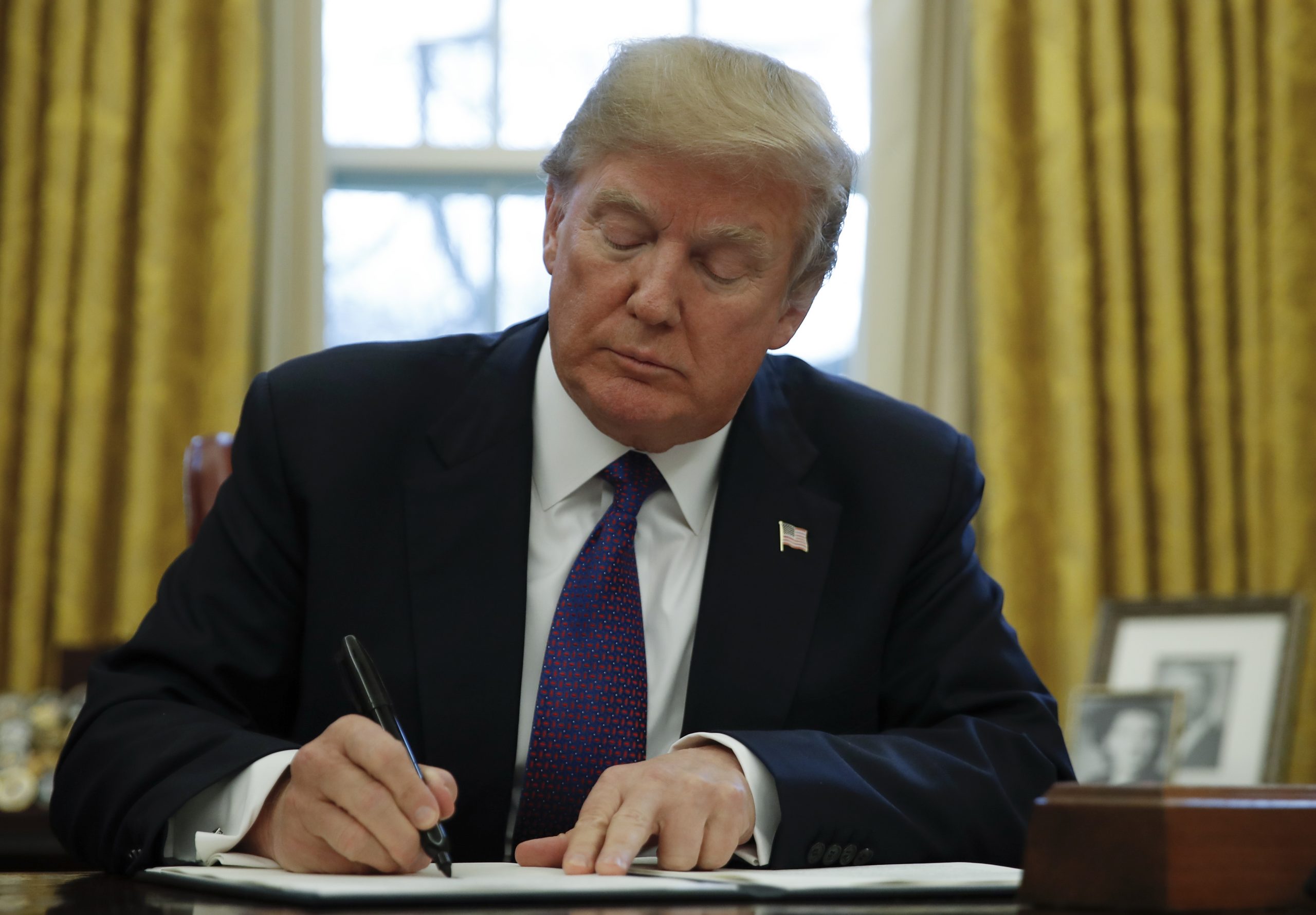 Trump signs order pushing work requirements for safety net programs