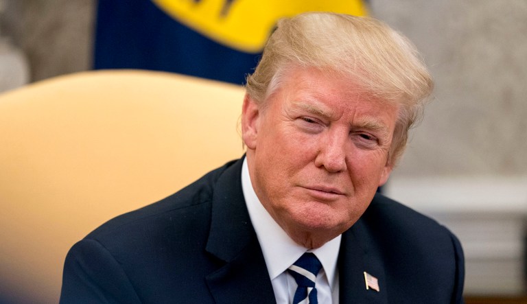 President Trump attends a meeting.