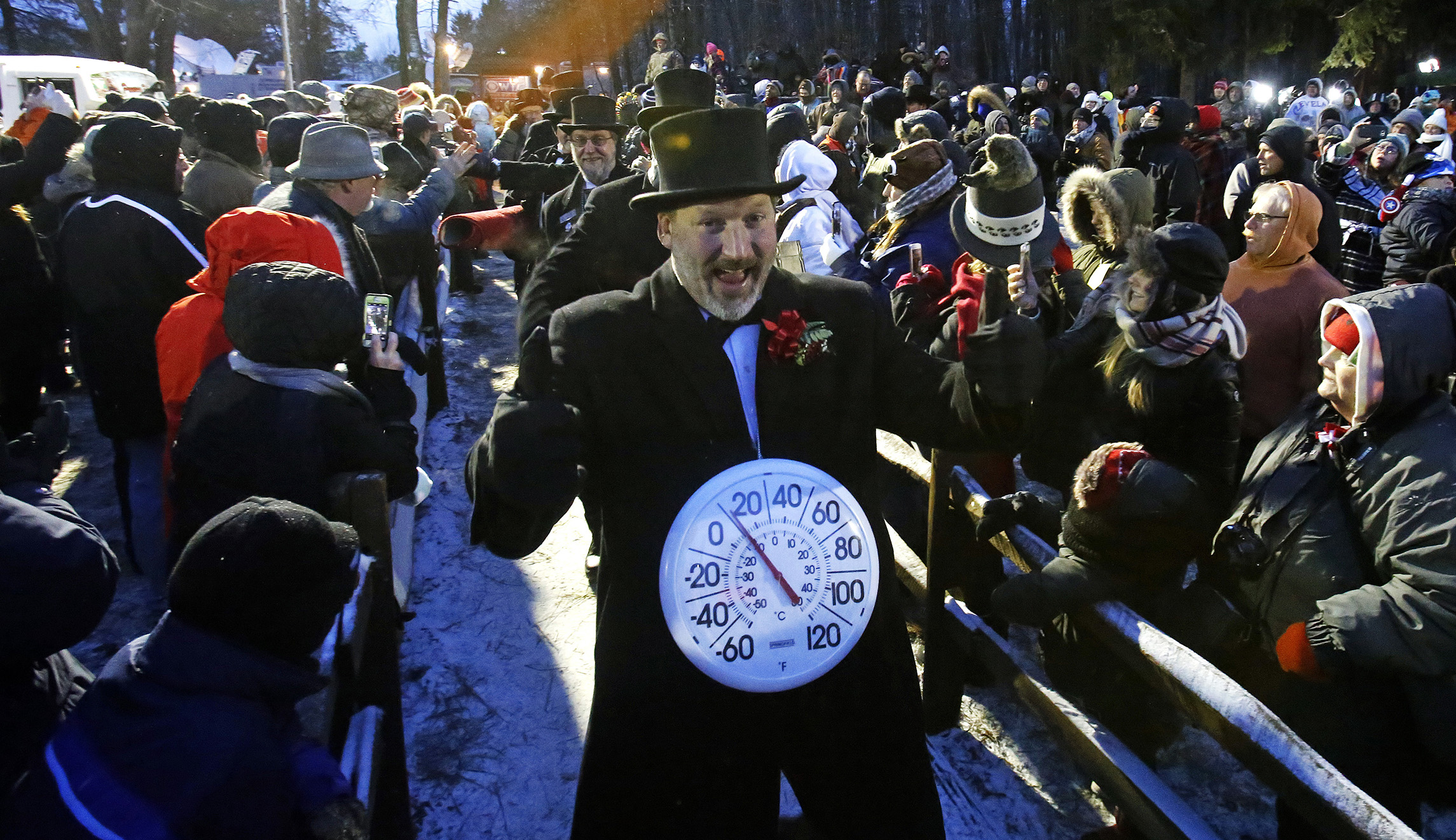 Groundhog Club inner circle member John Grusky wears a thermometer around his neck as he makes the trek to Gobblers Knob for the celebration of the 132nd Groundhog Day in Punxsutawney, Pa., on Saturday.