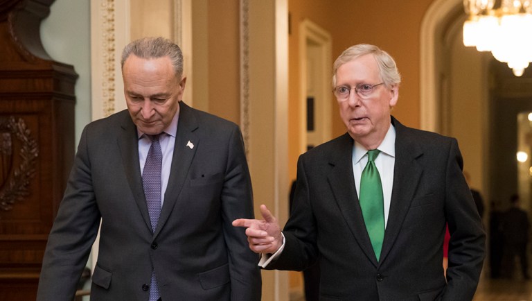 Senate Majority Leader Chuck Schumer (D-NY) and Senate Minority Leader Mitch McConnell (R-KY) walk through Capitol Hill in Washington, D.C.