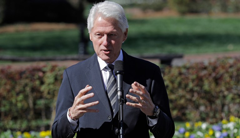 Former President Bill Clinton, left, speaks to the media after paying respects to Rev. Billy Graham during a public viewing at the Billy Graham Library in Charlotte, N.C., Tuesday, Feb. 27, 2018.