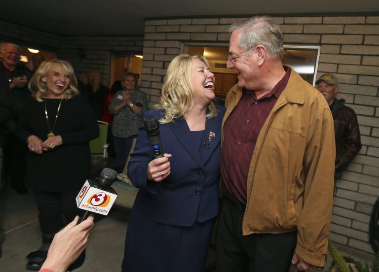 Republican candidate and former Arizona state Sen. Debbie Lesko celebrates with her husband, Joe, after voting results show her victory in a special primary election for the Congressional District 8 seat during a campaign party at Lesko's home, Tuesday, Feb. 27, 2018, in Glendale, Ariz. A special primary election was being held to replace Arizona Republican Rep. Trent Franks who resigned amid accusations of sexual misconduct.