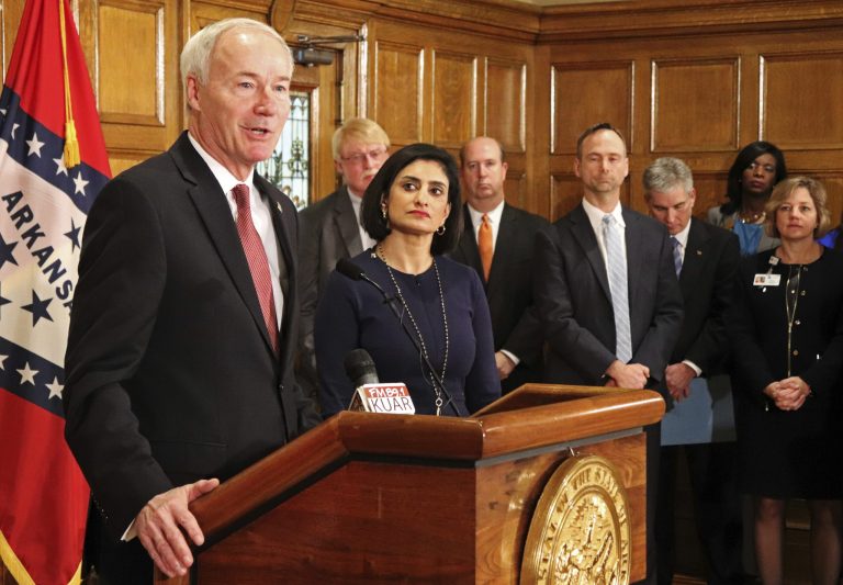 Gov. Asa Hutchinson speaks at a news conference Monday, March 5, 2018, at the state Capitol in Little Rock, Ark., with Seema Verma, the head of the Centers for Medicare and Medicaid Services. Verma on Monday approved a state plan to require that thousands of people on its Medicaid expansion seek ways to work or volunteer. Traditional Medicaid recipients are not affected. Arkansas is the third state to win permission, following Kentucky and Indiana.
