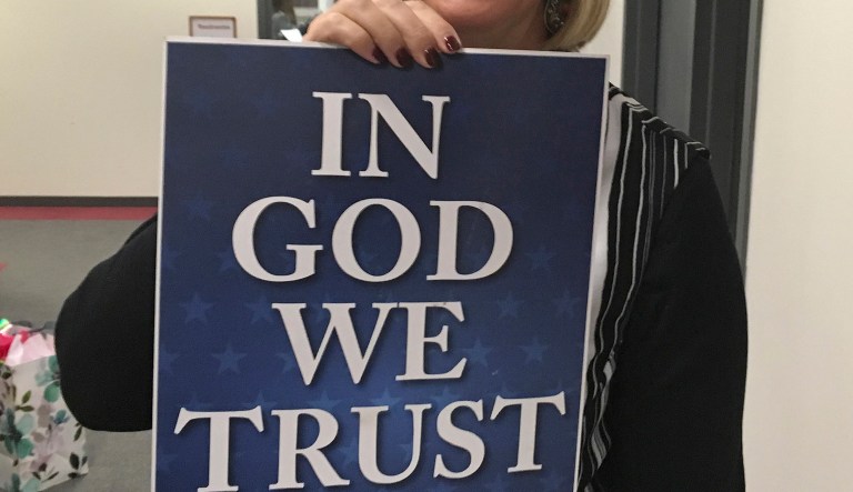 An example of an "In God We Trust" placard. 