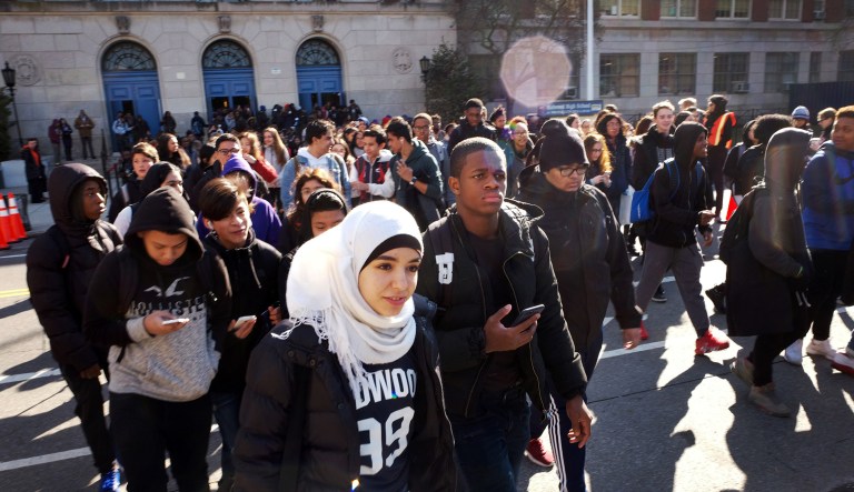 Hundreds of students walk out of Midwood High School in the Brooklyn borough of New York.